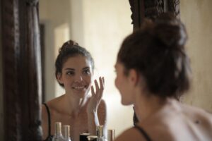 reflection photo of woman smiling